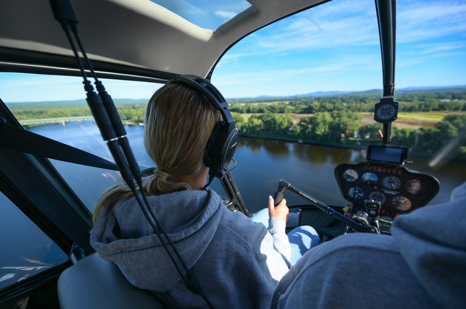 Hands on the controls over the Adirondacks